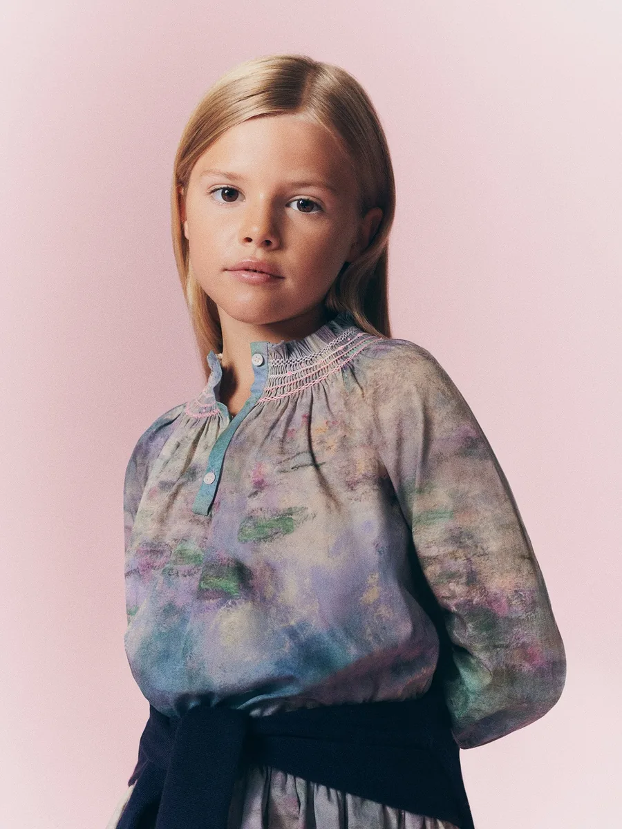Girl in the smocked Bonpoint x MoMA blouse in the water lily print