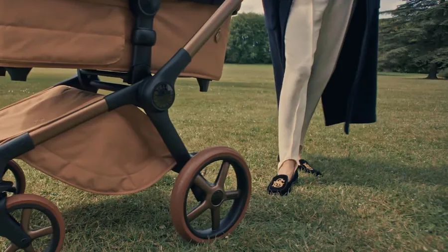 Bugaboo x Stella McCartney Fox 5 Renew in Tobacco Brown on a lawn