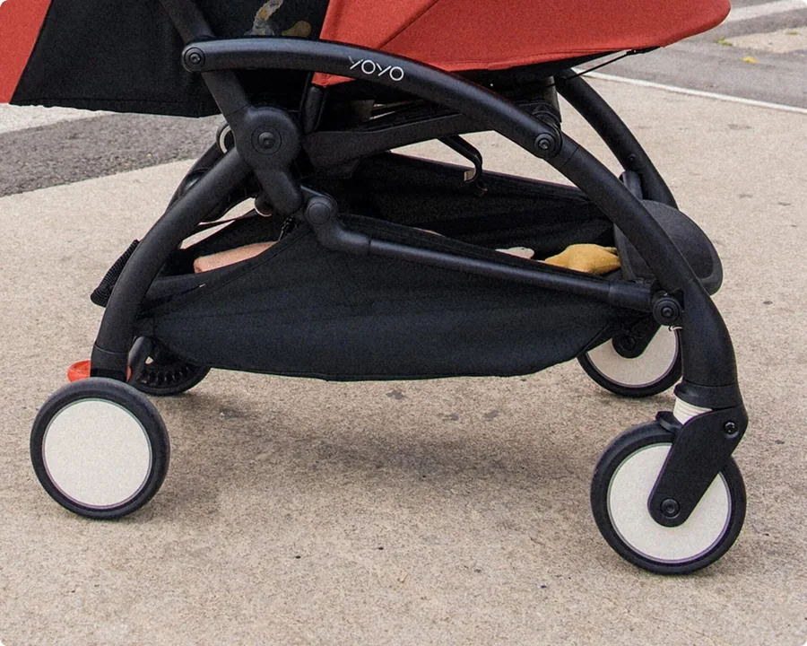 Wheels and frame of the Stokke YOYO⁵ on a pavement